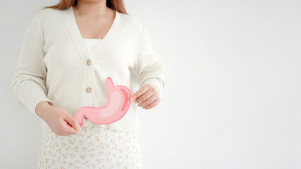 woman hands holding stomach, heartburn, Gastroesophageal reflux disease (GERD) or acid reflux...