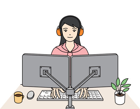 聴覚過敏のためイヤーマフを装着してPC作業する女性