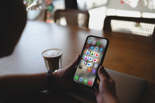 Bangkok, Thailand. March 10, 2026; A person holding a smartphone displaying a folder of Microsoft 365 productivity applications, including Word, Excel, and Copilot.
