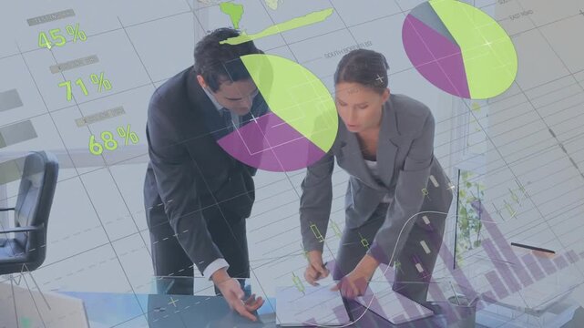 After talking, business partners leaning at desk annotating and signing report with animated charts