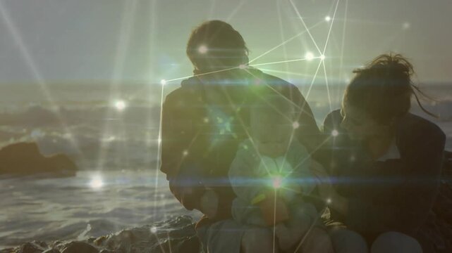 Sun glare and node overlay starting shore father bending mother reaching revealing infant for care