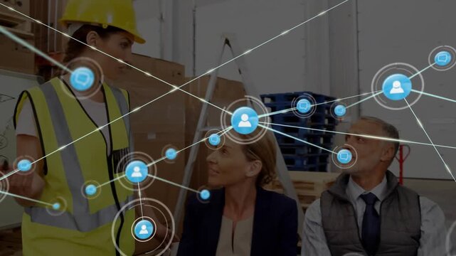 Presenter gesturing and foreman pointing in warehouse, starting animated nodes linking logistics