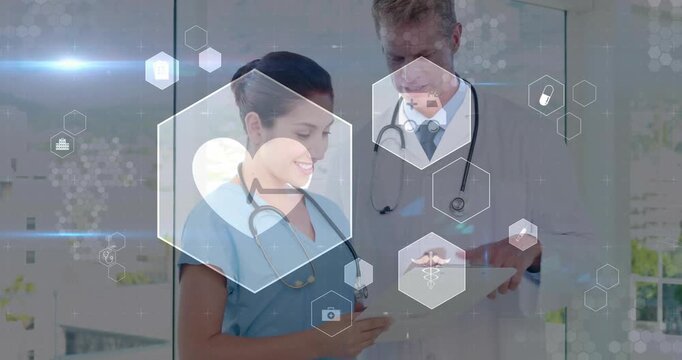 Nurse tapping cell, Dr pointing chart, reviewing medical data for care, hexagons responding to taps