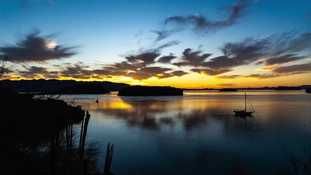 Beautiful sunrise over ocean bay islands sail boat 
