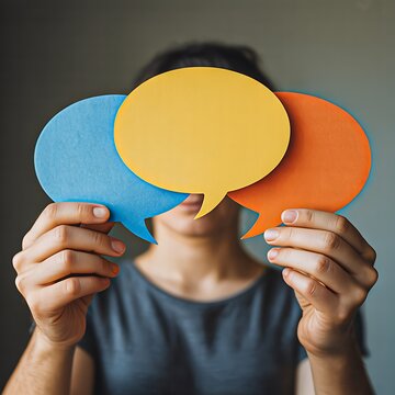 Colorful speech bubbles covering face representing communication concept