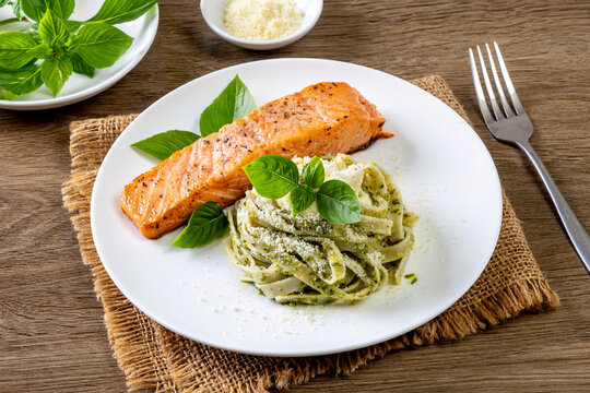 pasta spaghetti with pesto green and salmon - Italian food style