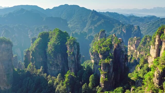 Sandstone pillars and lush green mountains in Zhangjiajie National Forest Park, Hunan, China.