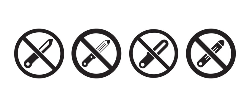Collection of four prohibition signs depicting sharp objects and tools that should not be used..