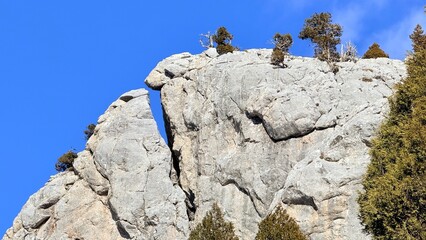 The separate pieces formed in the large rock and its mysterious appearance.