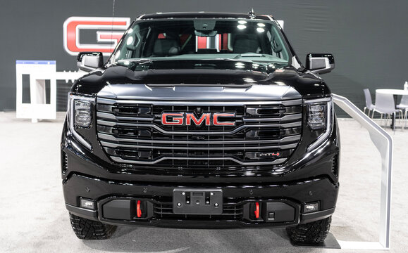 New York City, USA - March 27, 2024: Auto Show 2024. GMC Sierra 1500 car model. GMC Sierra 1500 pickup truck. GMC Sierra 1500 V8 car. 2024 GMC Sierra 1500 black color, front view