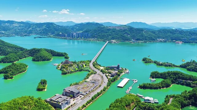 Scenic aerial view of turquoise water and green islands at Thousand Island Lake in Chun'an, China.