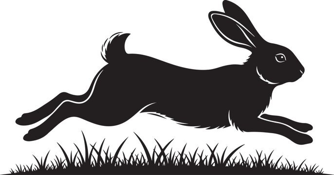Black silhouette of a rabbit jumping over grass