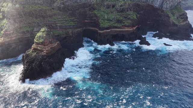Stunning aerial perspective of Roque de El Cagado, a dramatic volcanic rock formation on the rugged coastline of Santa Ursula in Tenerife