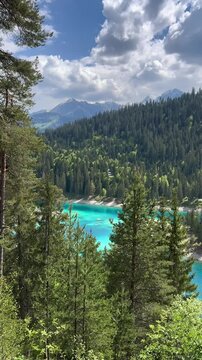 Alpine lake turquoise Caumasee Cauma in Switzerland turquoise waters and forested surroundings