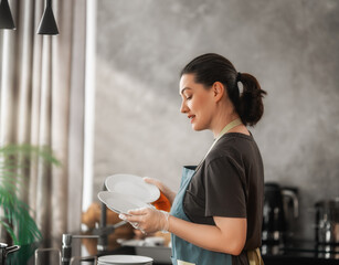 Woman Wearing Apron Washing Dishes in Modern Home Kitchen, Daily Domestic Chores