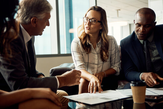 Talking, people or meeting with documents in business for finance proposal, company growth or update. Explain, financial investors or ROI timeline in lobby for KPI data, performance and exit strategy