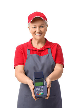 Mature female cashier with payment terminal on white background