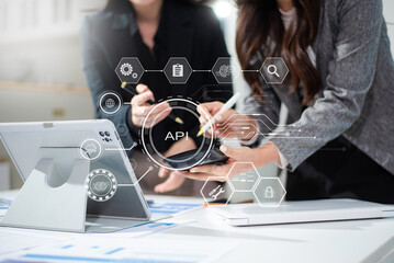 API Application Programming Interface, woman using laptop, tablet and smartphone with virtual...