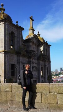 Male Traveler Exploring Historic Architecture in Porto Portugal