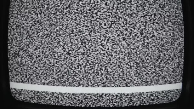 A close up of static television screen showing noise and interference pattern