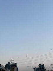 blue sky over city skyline