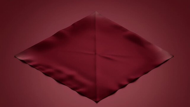 Elegant close up of a crimson red silk scarf on matching surface