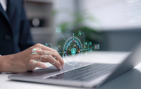 Businesswoman using laptop with cybersecurity digital interface showing data protection network security encryption cloud technology privacy system firewall and secure information management concept
