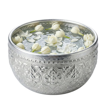 Thai silver water bowl with floating white jasmine flowers