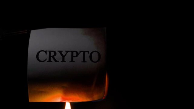 Word CRYPTO burning in slow motion close-up