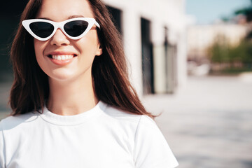 Portrait of young beautiful smiling woman in trendy summer clothes. Sexy carefree woman posing in...