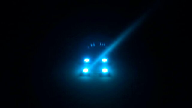 Car Headlights Shining Brightly in Darkness.