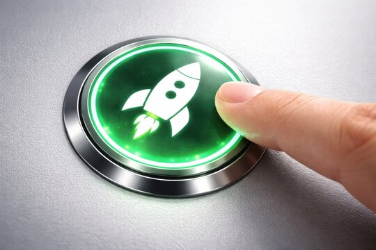 Finger pressing glowing green rocket launch button for startup and success concept