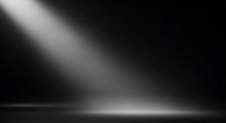 Dramatic diagonal spotlight beam on dark grey background for cinematic product reveal and creative advertising display