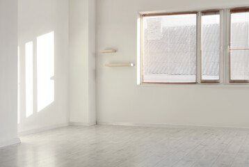 View of light walls with shelves and window