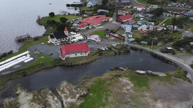 Drone flyover Maori village Ohinemutu, Cultural heritage. Rotorua, New Zealand