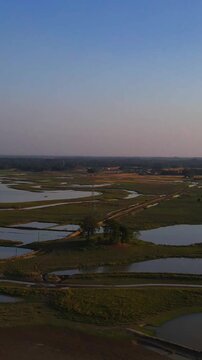Sunset on the farming fiels of Haor region in Bangladesh.