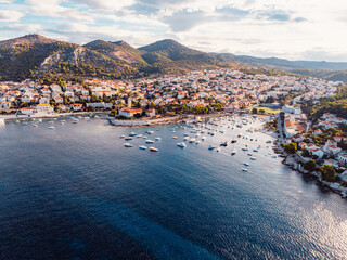 Fototapeta premium Aerial view of the historic Hvar town and the Spanish Fortress (Fortica) overlooking the harbor and Adriatic sea, Hvar island, Dalmatia, Croatia.