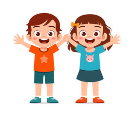 Happy young Asian boy and girl standing together holding hands raising arms with big smiles full of joy