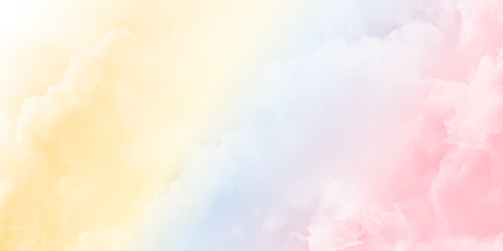 Beautiful fluffy white clouds on pastel clear sky