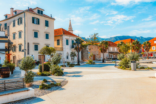 Jelsa town on Hvar island, with traditional Dalmatian stone architecture and boats moored in the harbor, Croatia.