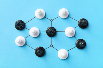 Fototapeta premium Connected pawns on blue background. Link concept