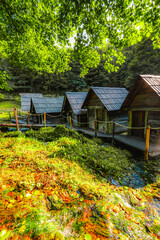 Historic wooden watermills (Mlincici) on the travertine barriers of Plivsko Lake near Jajce, Bosnia and Herzegovina.