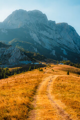 Fototapeta premium Sunset over the Maglic mountain massif seen from Prijevor saddle in Sutjeska National Park, the highest peak of Bosnia and Herzegovina at golden hour.