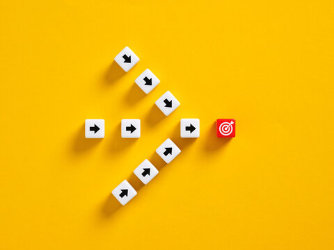 Arrows reaching target goal on yellow background