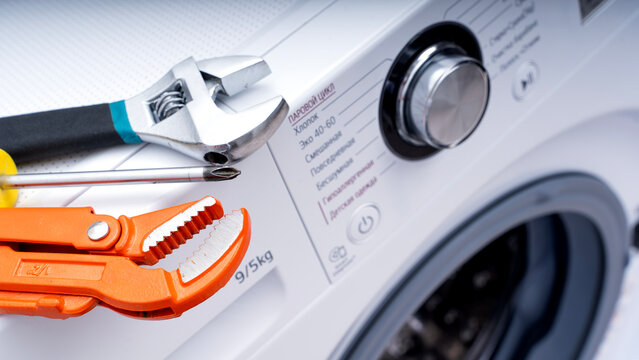 Washing machine repair tool on washing machine