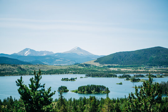 Dillon Reservoir with forested islands and Rocky Mountains, Colo