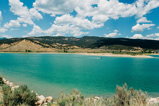 Turquoise reservoir and mountains at Rifle Gap State Park, Color