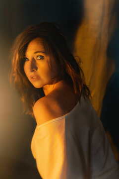 Portrait of woman looking back in warm light