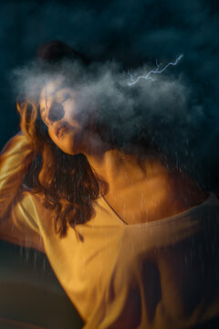 Woman with Head in Thunderclouds and Raining
