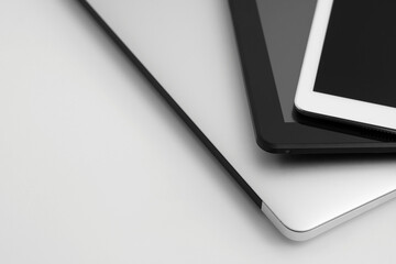 Composition with modern gadgets on light background, closeup